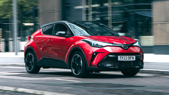 Red Toyota C-HR driving
